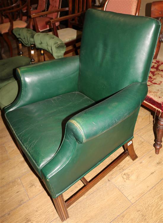 A George III style green leather armchair